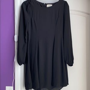 Black lined dress  pleats down front, above knee, size small, long sleeves